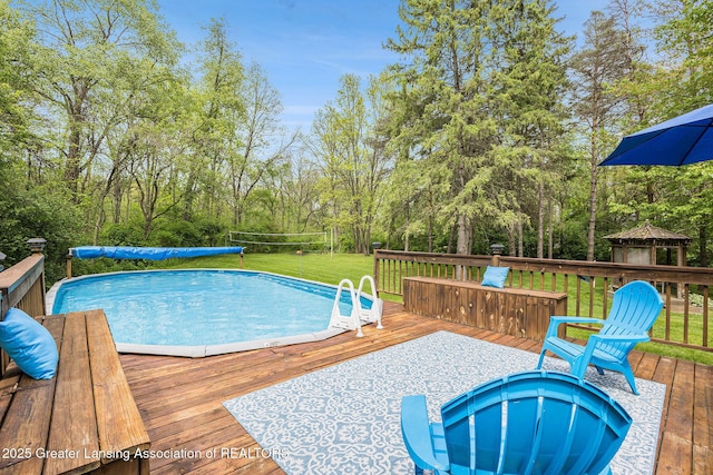 8450 Pineview Lake Dr, Linden, MI 48451 - view of swimming pool featuring a deck, a lawn, and a gazebo