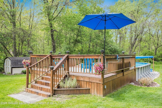 8450 Pineview Lake Dr, Linden, MI 48451 - wooden terrace featuring a yard, an outdoor pool, and a wooded view