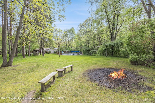 8450 Pineview Lake Dr, Linden, MI 48451 - view of green lawn featuring a fire pit