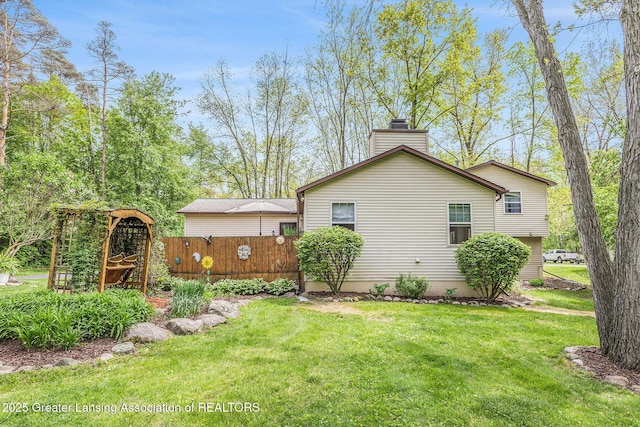 8450 Pineview Lake Dr, Linden, MI 48451 - view of side of home featuring a chimney