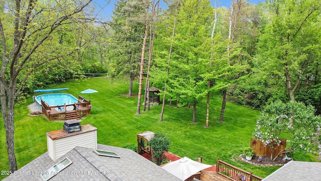 8450 Pineview Lake Dr, Linden, MI 48451 - view of green lawn featuring a deck and a covered pool