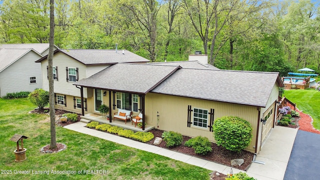 8450 Pineview Lake Dr, Linden, MI 48451 - view of front of house with a shingled roof, driveway, a chimney, a porch, and a front lawn