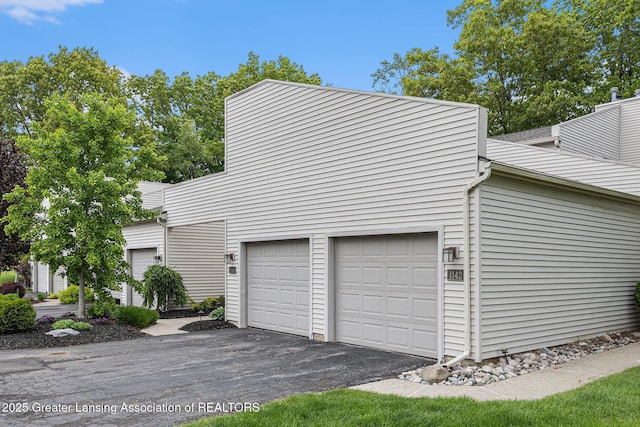 1146 S Ridge Rd, Lansing, MI 48917 - garage with asphalt driveway