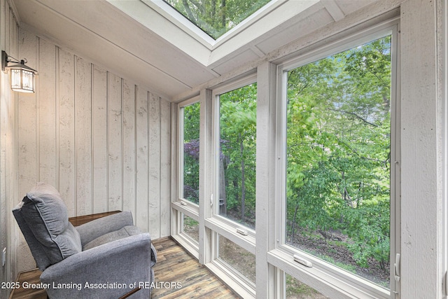 1146 S Ridge Rd, Lansing, MI 48917 - sunroom / solarium with wood finished floors, wooden walls, plenty of natural light, and a skylight