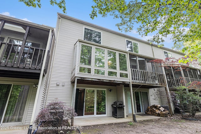 1146 S Ridge Rd, Lansing, MI 48917 - back of house featuring a sunroom