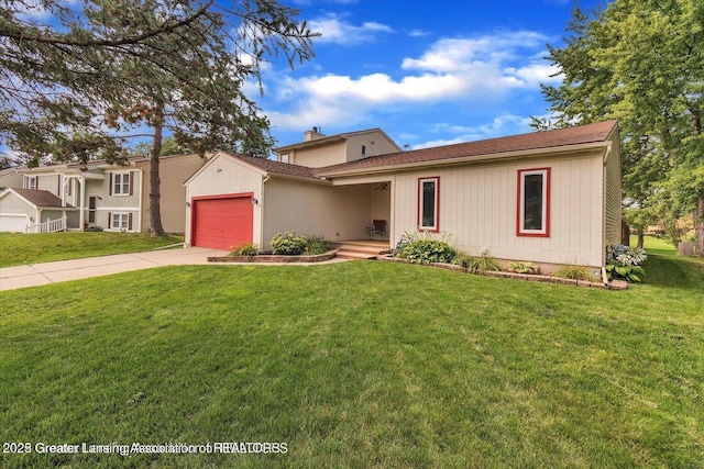 524 Dutch Hill Dr, Lansing, MI 48917 - view of front of property with an attached garage, driveway, a front lawn, and roof with shingles