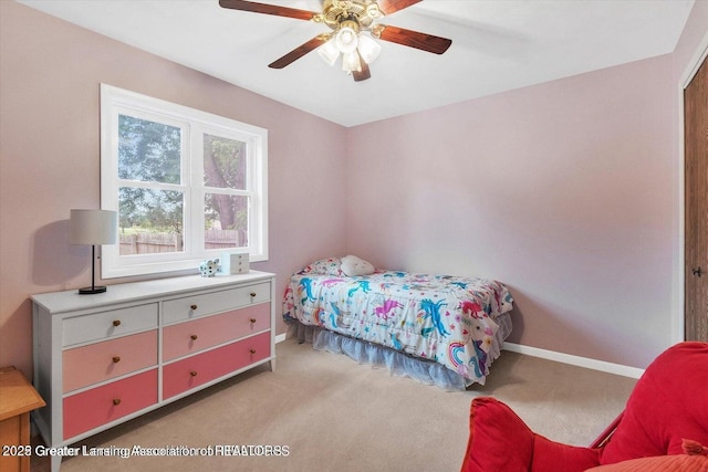 524 Dutch Hill Dr, Lansing, MI 48917 - bedroom featuring light colored carpet, baseboards, and ceiling fan