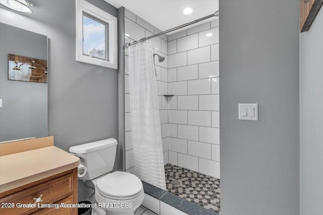 524 Dutch Hill Dr, Lansing, MI 48917 - full bath featuring toilet, tiled shower, vanity, and recessed lighting