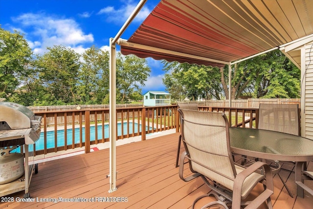 524 Dutch Hill Dr, Lansing, MI 48917 - deck with outdoor dining space and a fenced backyard