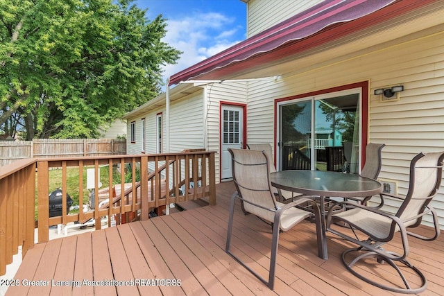 524 Dutch Hill Dr, Lansing, MI 48917 - wooden deck with outdoor dining area