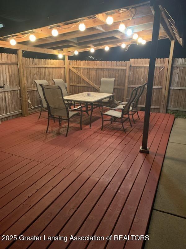 524 Dutch Hill Dr, Lansing, MI 48917 - wooden terrace with a fenced backyard and outdoor dining space