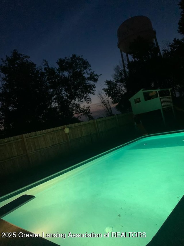 524 Dutch Hill Dr, Lansing, MI 48917 - view of swimming pool featuring a diving board