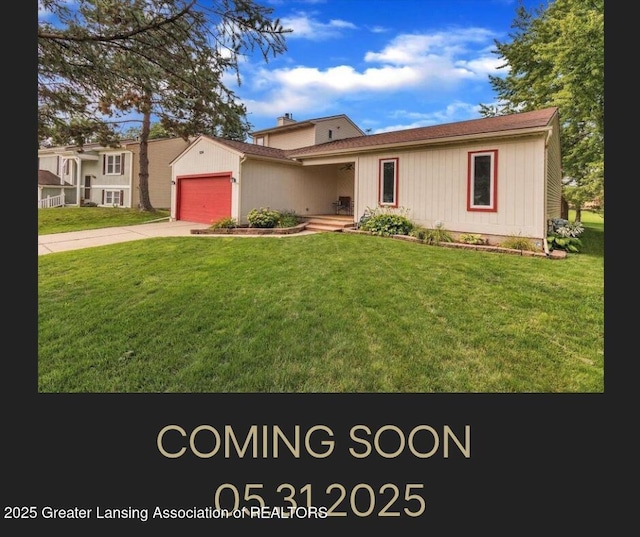 524 Dutch Hill Dr, Lansing, MI 48917 - view of front of home with an attached garage, driveway, and a front yard