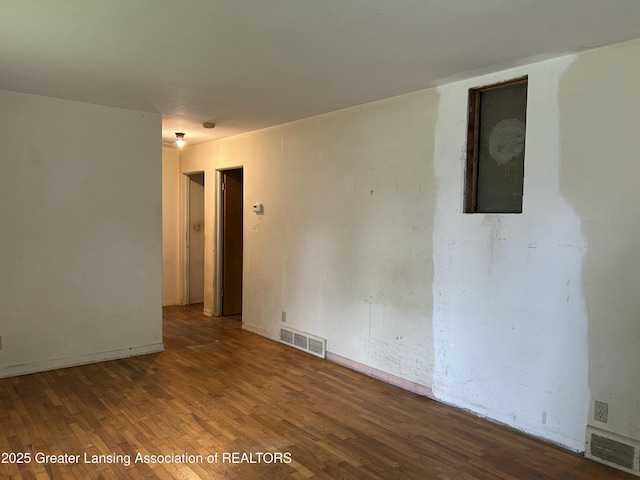 657 Spartan Ave, East Lansing, MI 48823 - unfurnished room with wood finished floors and baseboards