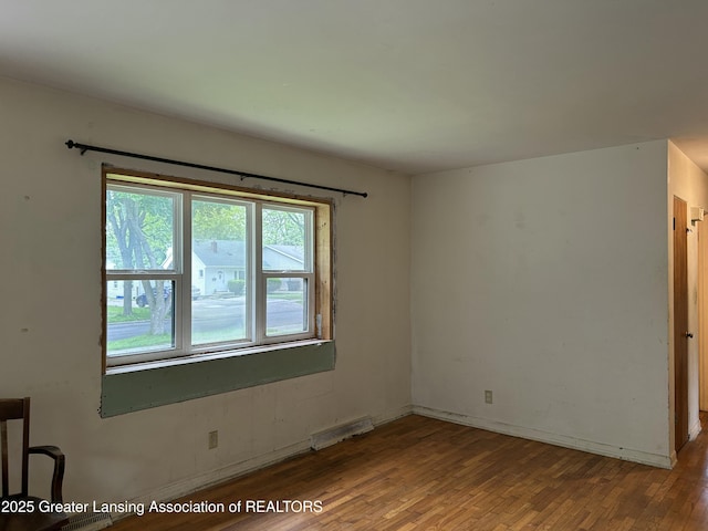 657 Spartan Ave, East Lansing, MI 48823 - spare room with wood finished floors and baseboards