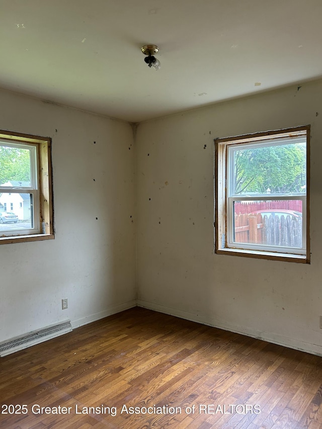 657 Spartan Ave, East Lansing, MI 48823 - unfurnished room featuring wood finished floors and baseboards