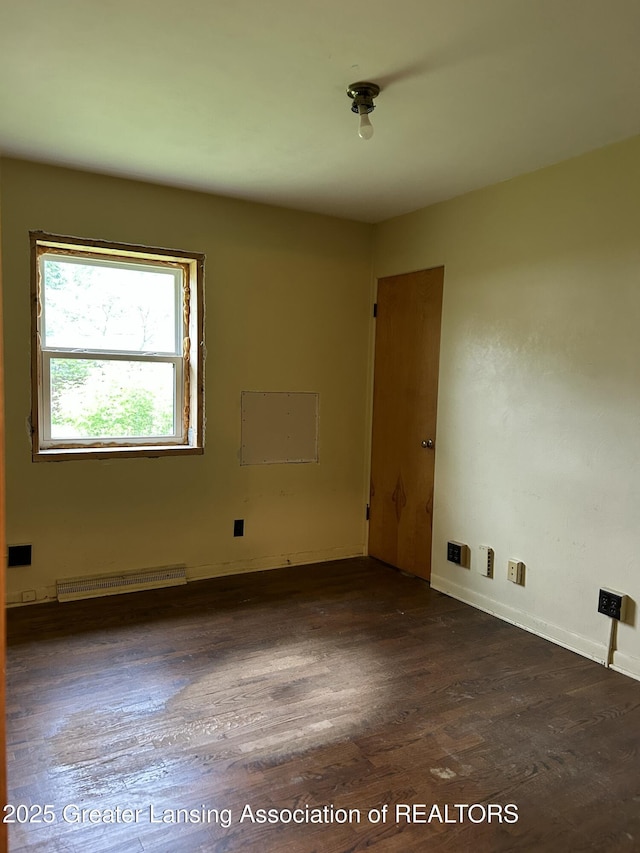657 Spartan Ave, East Lansing, MI 48823 - unfurnished room featuring wood finished floors and baseboards