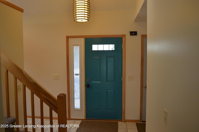 2397 Emerald Forest Cir Unit 26, East Lansing, MI 48823 - entryway featuring light tile patterned flooring and stairs