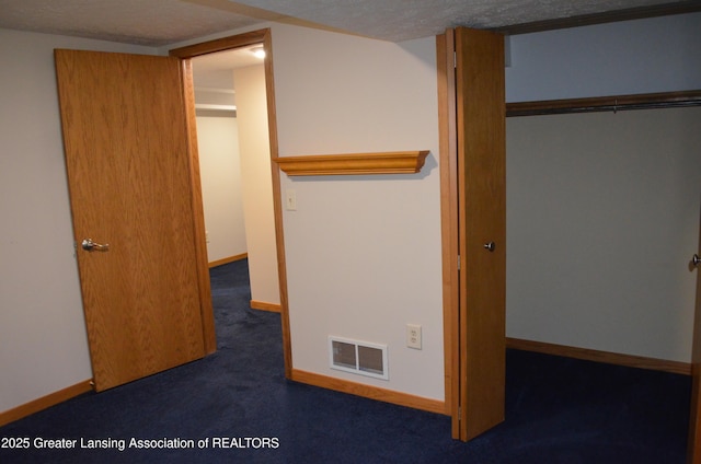 2397 Emerald Forest Cir Unit 26, East Lansing, MI 48823 - unfurnished bedroom with carpet flooring and a closet