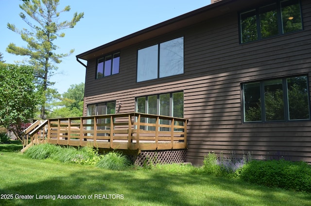 2397 Emerald Forest Cir Unit 26, East Lansing, MI 48823 - back of house featuring a wooden deck and a yard