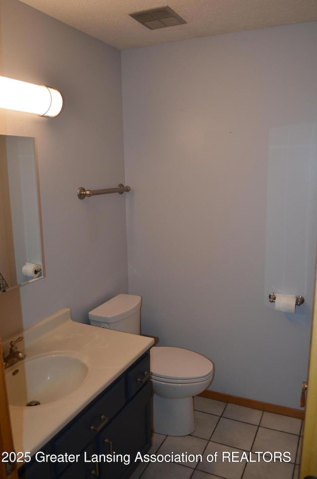 2397 Emerald Forest Cir Unit 26, East Lansing, MI 48823 - half bath with vanity and tile patterned flooring