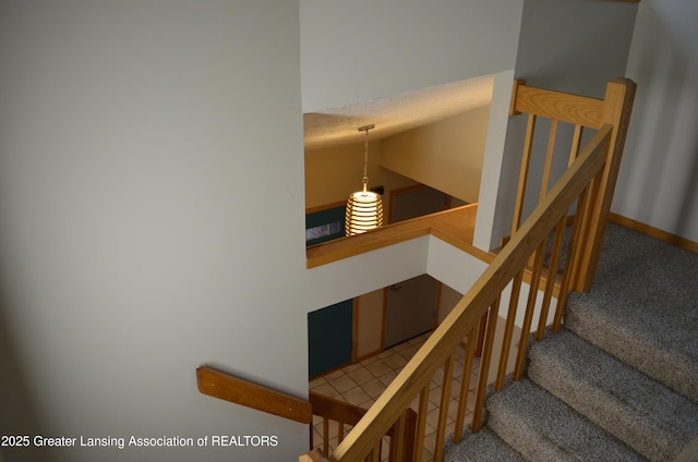 2397 Emerald Forest Cir Unit 26, East Lansing, MI 48823 - stairs with carpet and baseboards