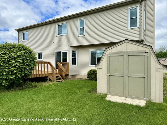 1512 Lindy Dr, Lansing, MI 48917 - back of property featuring a deck and a lawn