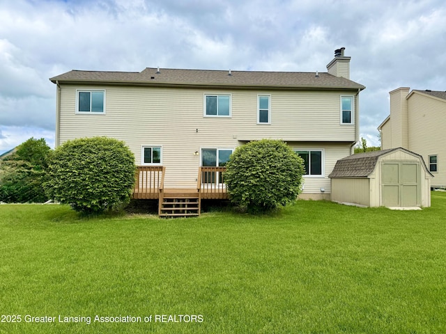 1512 Lindy Dr, Lansing, MI 48917 - back of house with a deck, a chimney, and a lawn