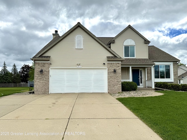 1512 Lindy Dr, Lansing, MI 48917 - traditional-style home with brick siding, concrete driveway, a front lawn, and a shingled roof