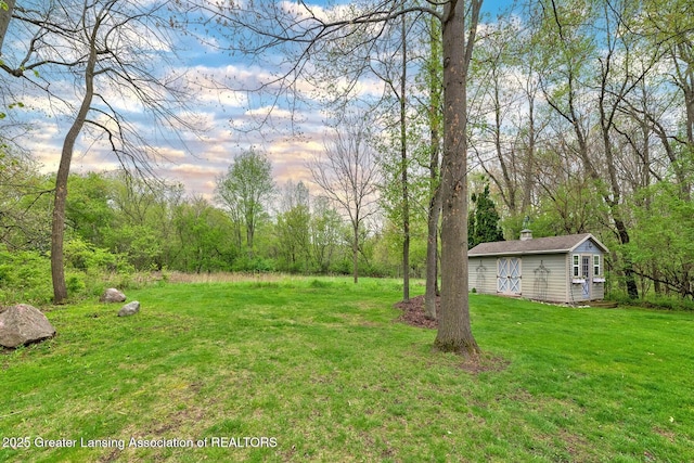 4767 Mohican Ln, Okemos, MI 48864 - view of green lawn featuring an outdoor structure