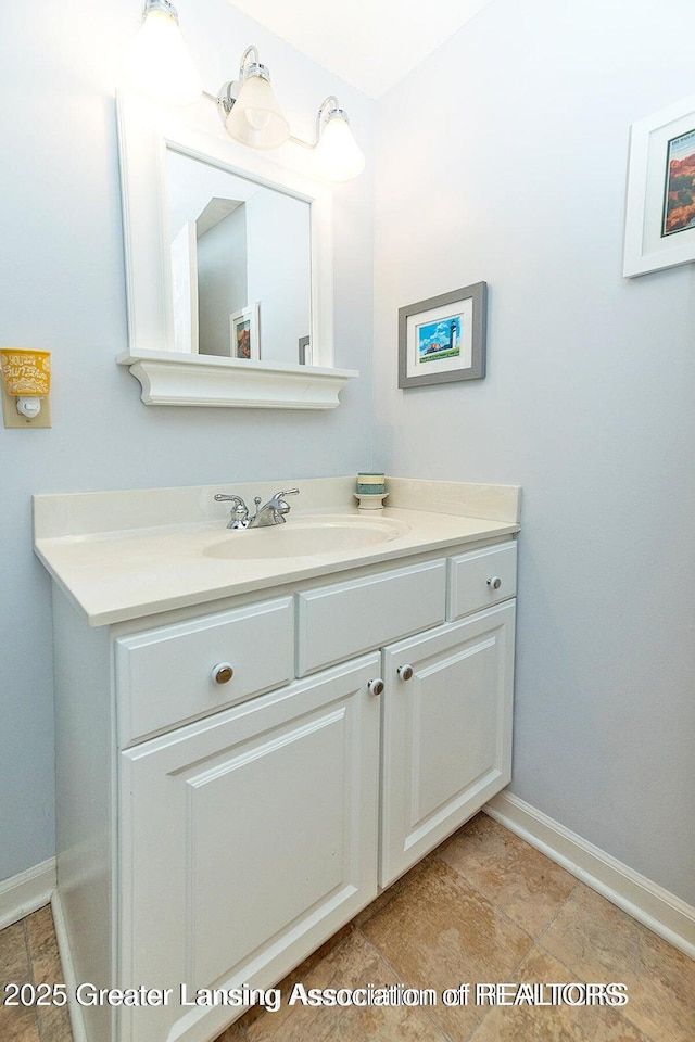 4767 Mohican Ln, Okemos, MI 48864 - bathroom featuring vanity and baseboards