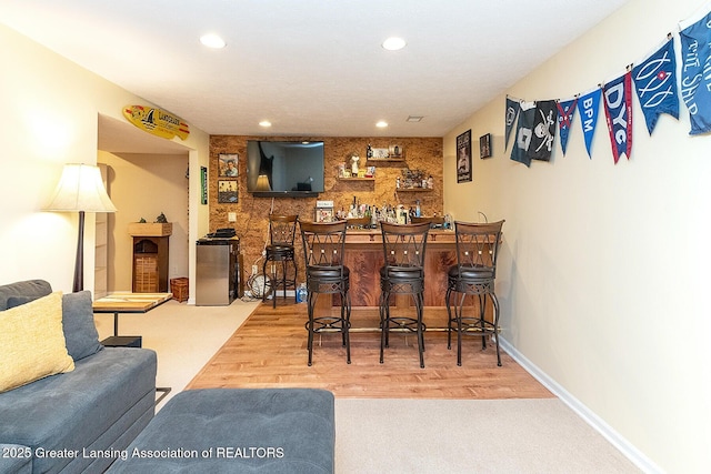 4767 Mohican Ln, Okemos, MI 48864 - indoor wet bar featuring recessed lighting, wood finished floors, carpet floors, and baseboards