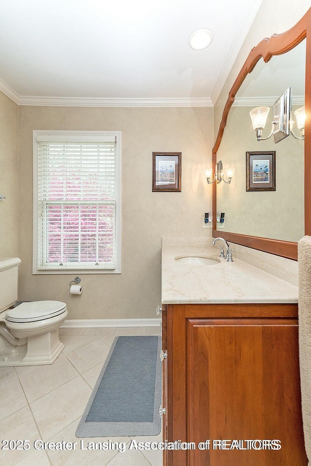 4767 Mohican Ln, Okemos, MI 48864 - bathroom featuring toilet, vanity, ornamental molding, tile patterned flooring, and baseboards