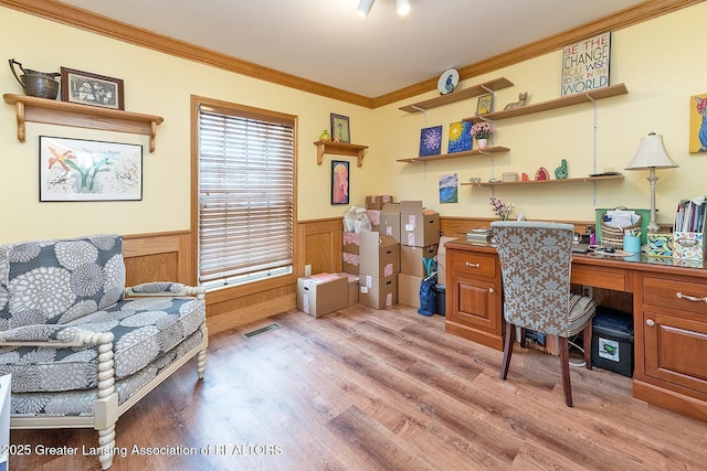 4767 Mohican Ln, Okemos, MI 48864 - office space featuring a wainscoted wall, crown molding, light wood-type flooring, and built in desk