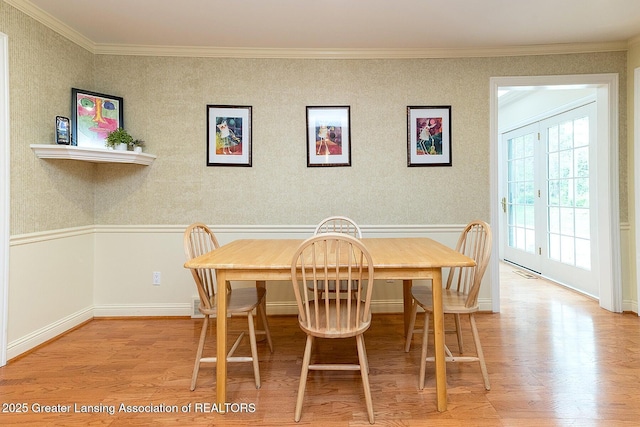 4767 Mohican Ln, Okemos, MI 48864 - dining space with wood finished floors, ornamental molding, and baseboards