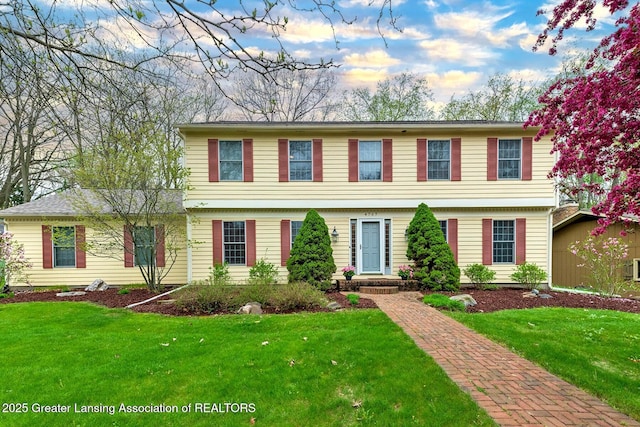 4767 Mohican Ln, Okemos, MI 48864 - colonial home featuring a front lawn