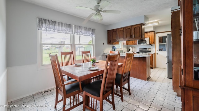 515 Chanticleer Trl, Lansing, MI 48917 - dining room with a ceiling fan