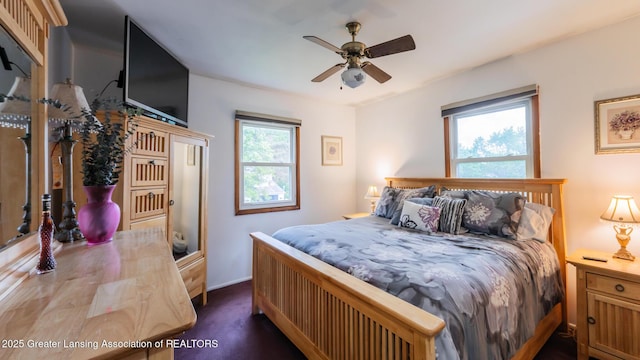 515 Chanticleer Trl, Lansing, MI 48917 - bedroom featuring baseboards and a ceiling fan