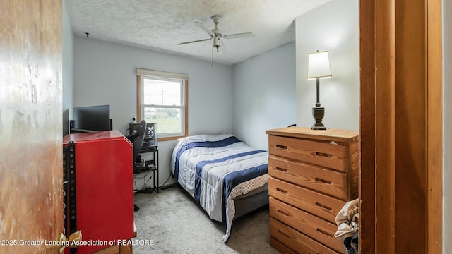 515 Chanticleer Trl, Lansing, MI 48917 - carpeted bedroom featuring a textured ceiling and ceiling fan