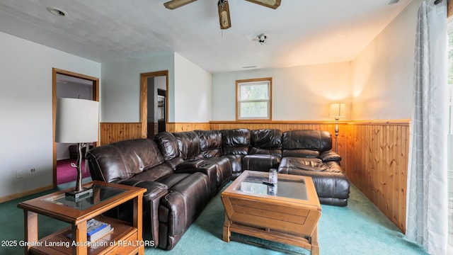 515 Chanticleer Trl, Lansing, MI 48917 - carpeted living area featuring wainscoting, wood walls, and ceiling fan