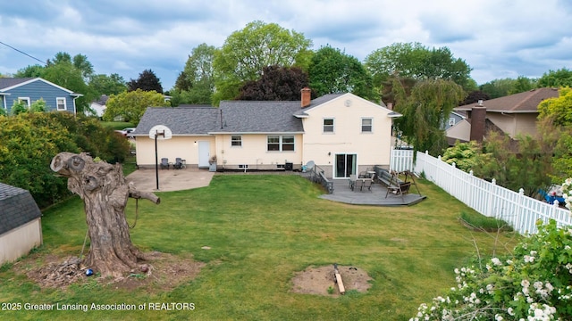 515 Chanticleer Trl, Lansing, MI 48917 - back of house featuring a patio and a chimney