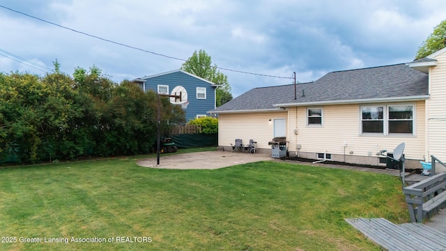 515 Chanticleer Trl, Lansing, MI 48917 - back of property featuring a patio area and roof with shingles