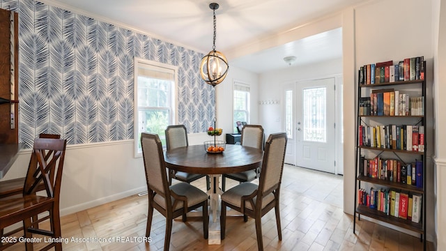 9181 Coleman Rd, Haslett, MI 48840 - dining area with light wood-type flooring, baseboards, and wallpapered walls