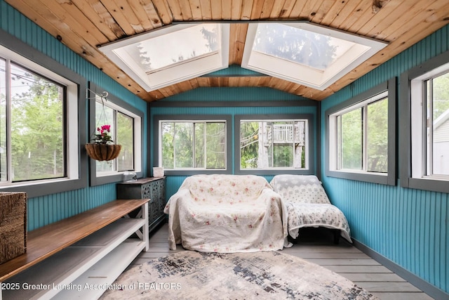 9181 Coleman Rd, Haslett, MI 48840 - sunroom featuring a skylight, wood-type flooring, vaulted ceiling, and wood walls