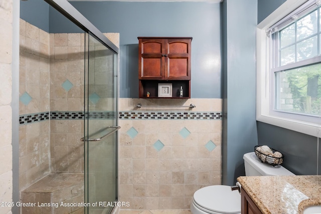 9181 Coleman Rd, Haslett, MI 48840 - full bath featuring vanity, a stall shower, and toilet