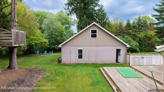 9181 Coleman Rd, Haslett, MI 48840 - rear view of property with a deck and a lawn
