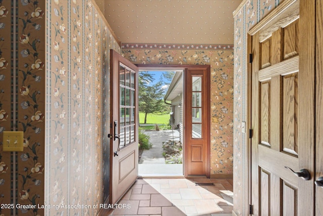 12560 Eaton Rapids Rd, Springport, MI 49284 - foyer entrance featuring wallpapered walls, stone tile flooring, and baseboards