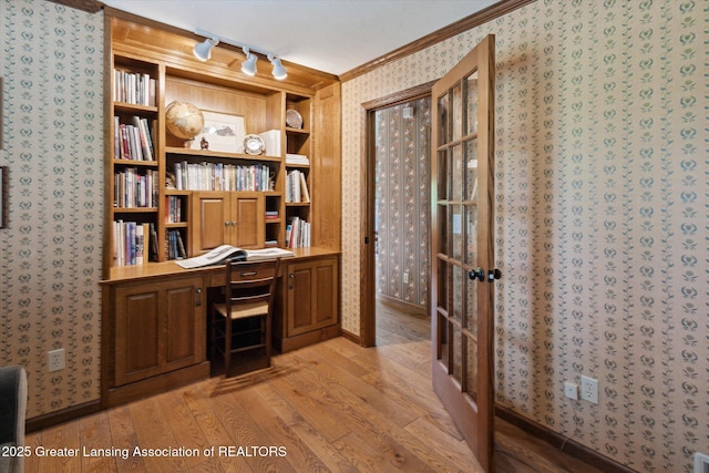 12560 Eaton Rapids Rd, Springport, MI 49284 - office space with wallpapered walls, light wood finished floors, crown molding, track lighting, and built in desk