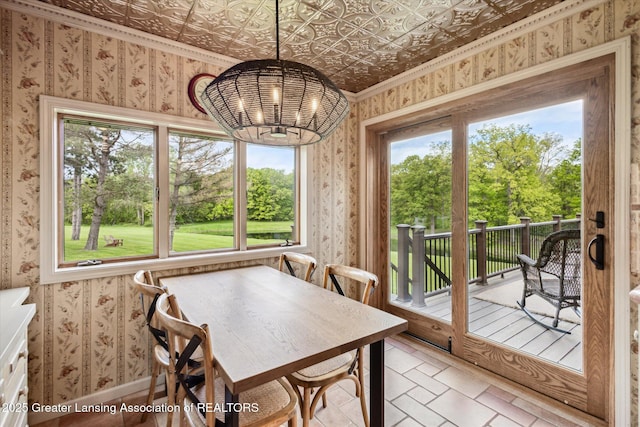 12560 Eaton Rapids Rd, Springport, MI 49284 - dining room with wallpapered walls, a chandelier, and an ornate ceiling