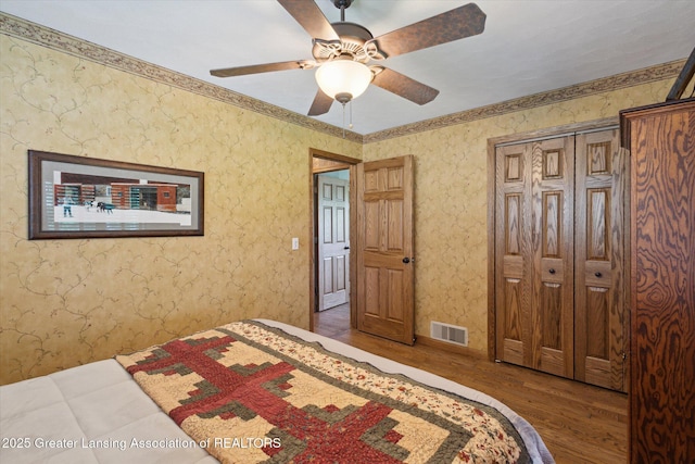 12560 Eaton Rapids Rd, Springport, MI 49284 - bedroom featuring wood finished floors, ornamental molding, and ceiling fan